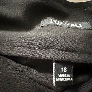 Roz and Ali pull on women’s slacks.